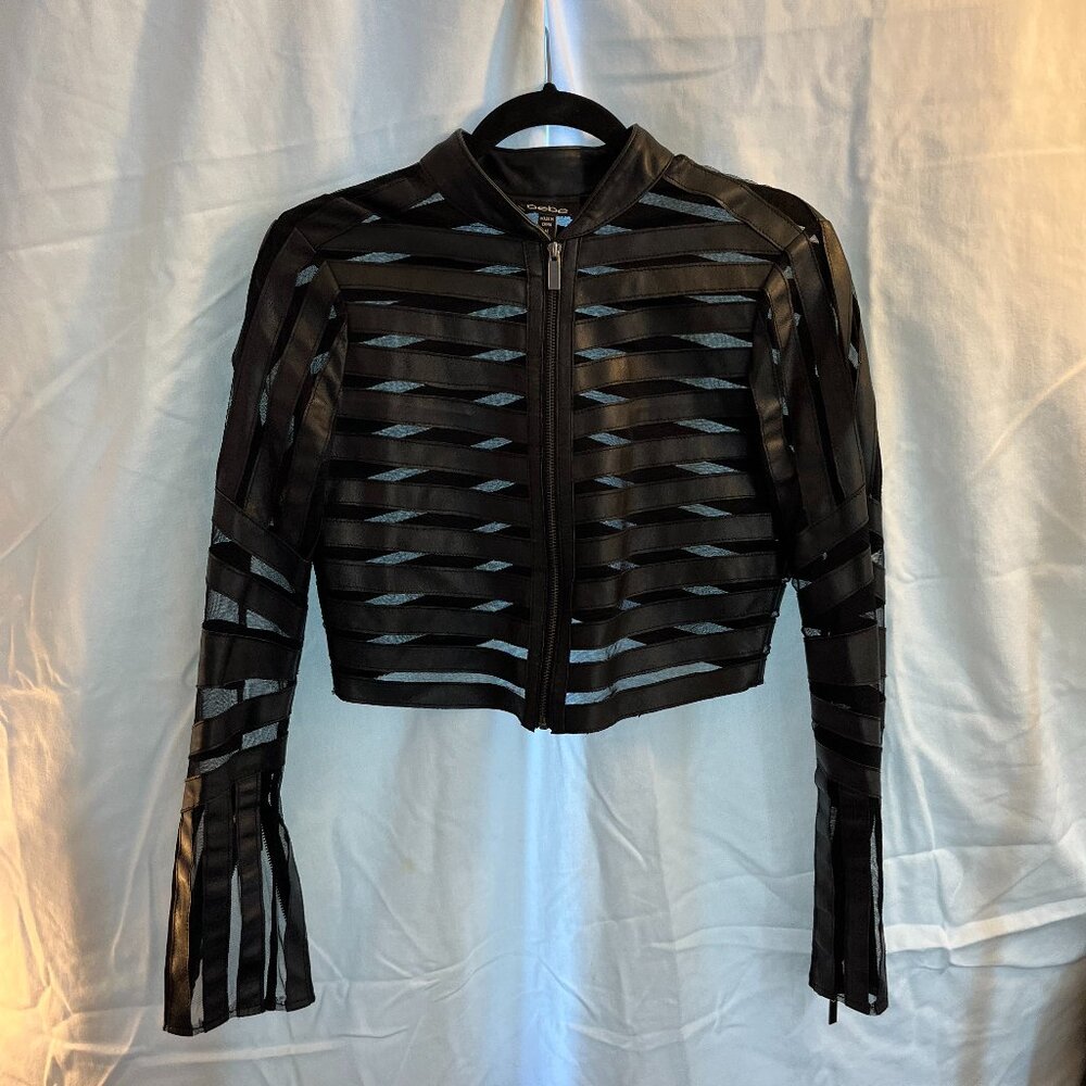 Bebe faux leather and mesh zip front jacket.